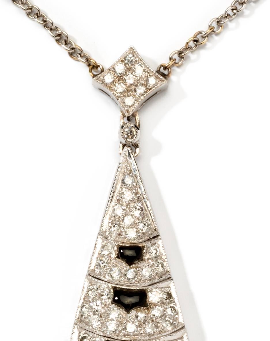 Art Deco style. Italy, 1920's. Designed as pavé-set with 127 diamonds in brilliant-cut weighing approximately 1,88 ct. Decorated with 6 onyx. Mounted in 18K white gold. Hallmarked on the clasp: 18K ITALY. Total weight: 11,55 grams. Measurements of