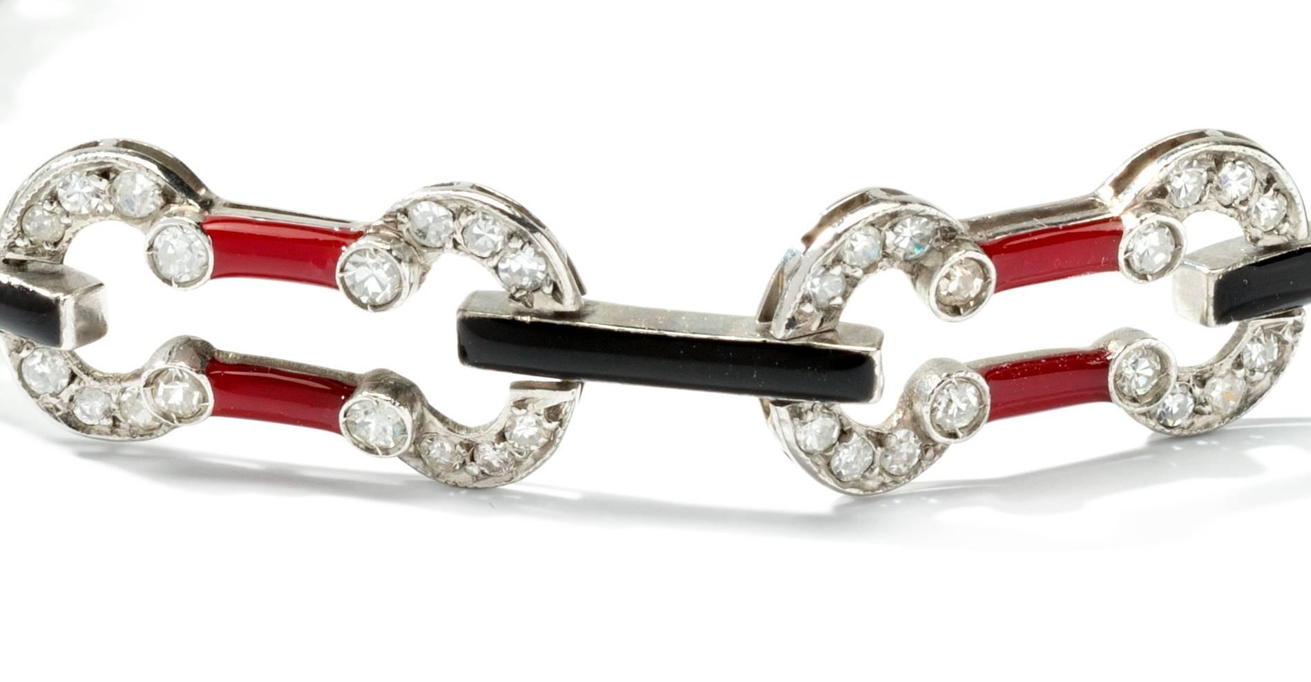 Europe, circa 1930. Art Deco set with 128 single-cut diamonds weighing circa 2.24 ct. With red and black enamel. Mounted in platinum. Total weight: 11,56 grams. Length: 7.09 in ( 18 cm )
