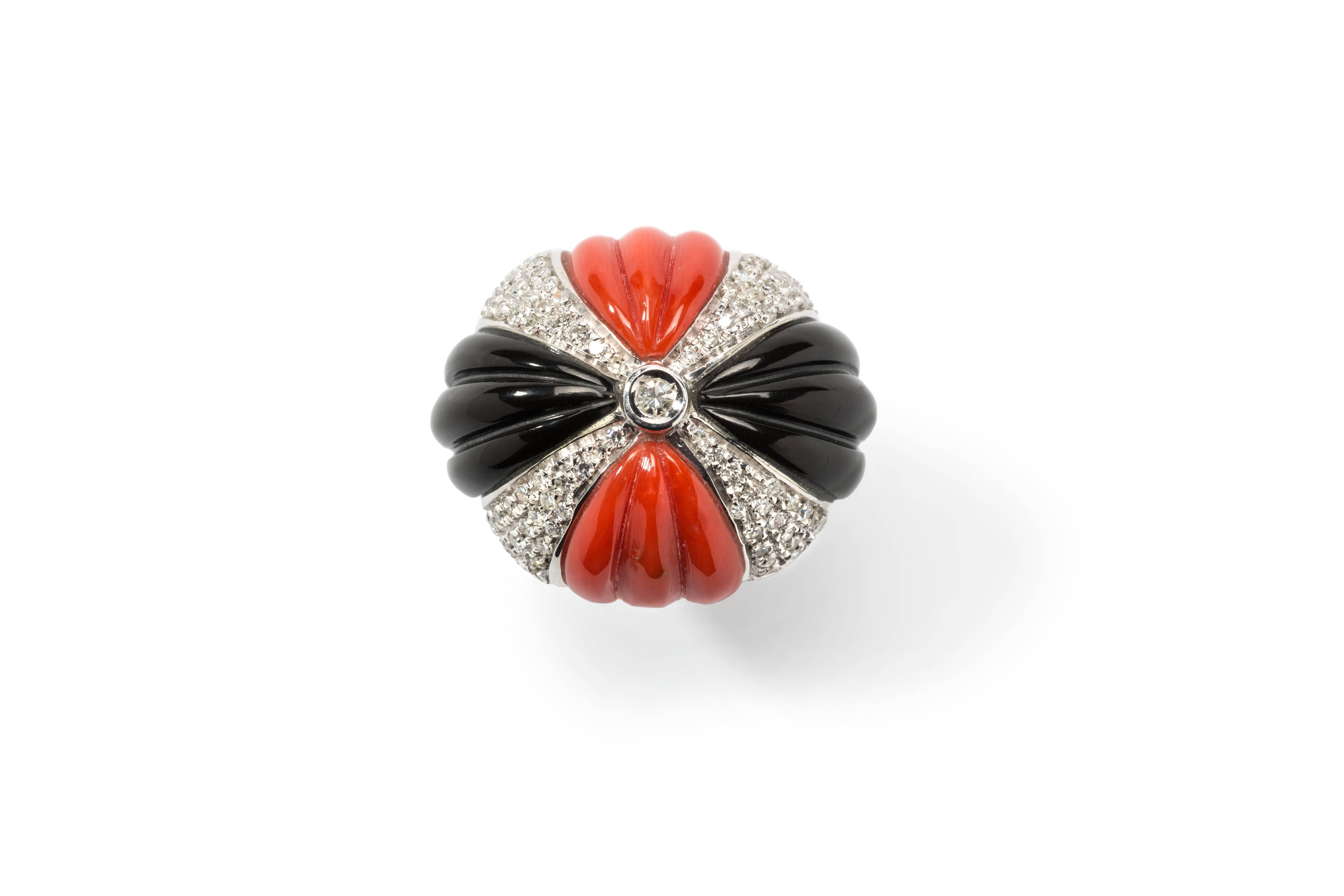 Bombe italian design. Carved mediterranean coral and onyx enhanced with 89 diamonds weighing approximately 1,82 carats. Mounted in 14K white gold. Total weight: 18,85 g. 
Measurements: 0.91 x 1.06 in ( 2,3 x 2,7 cm ). Height: 1.14 in ( 2,9 cm ).