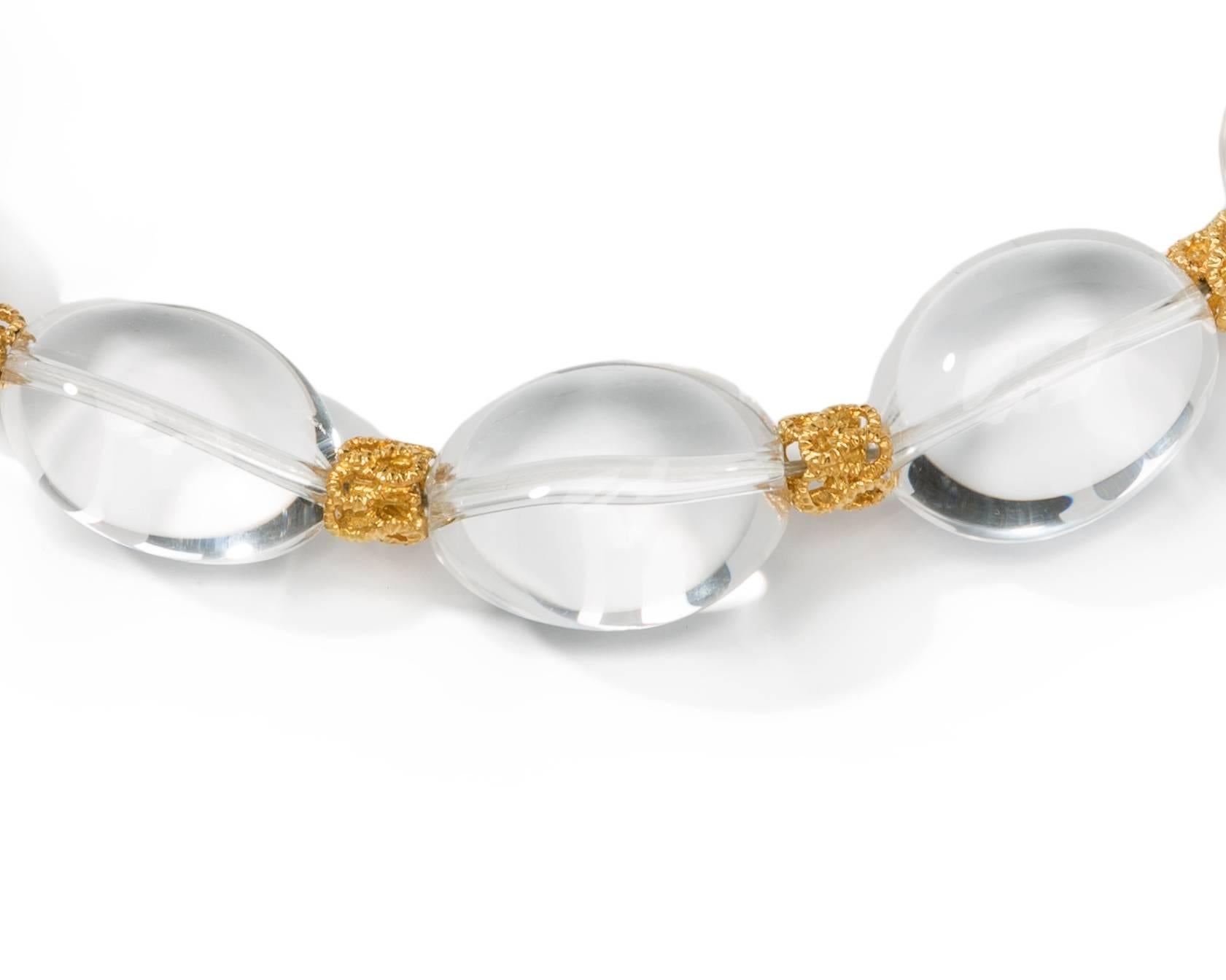 Italy, circa 1965. Set with 13 egg-shaped rock crystal beats. Separated by 12 18K yellow gold decoration pieces. 18K yellow ball clasp. Marked: 750, Star 293. ( Italian hallmarks) Total weight: 194.1 grams. Length: 18.5 in ( 47 cm )
