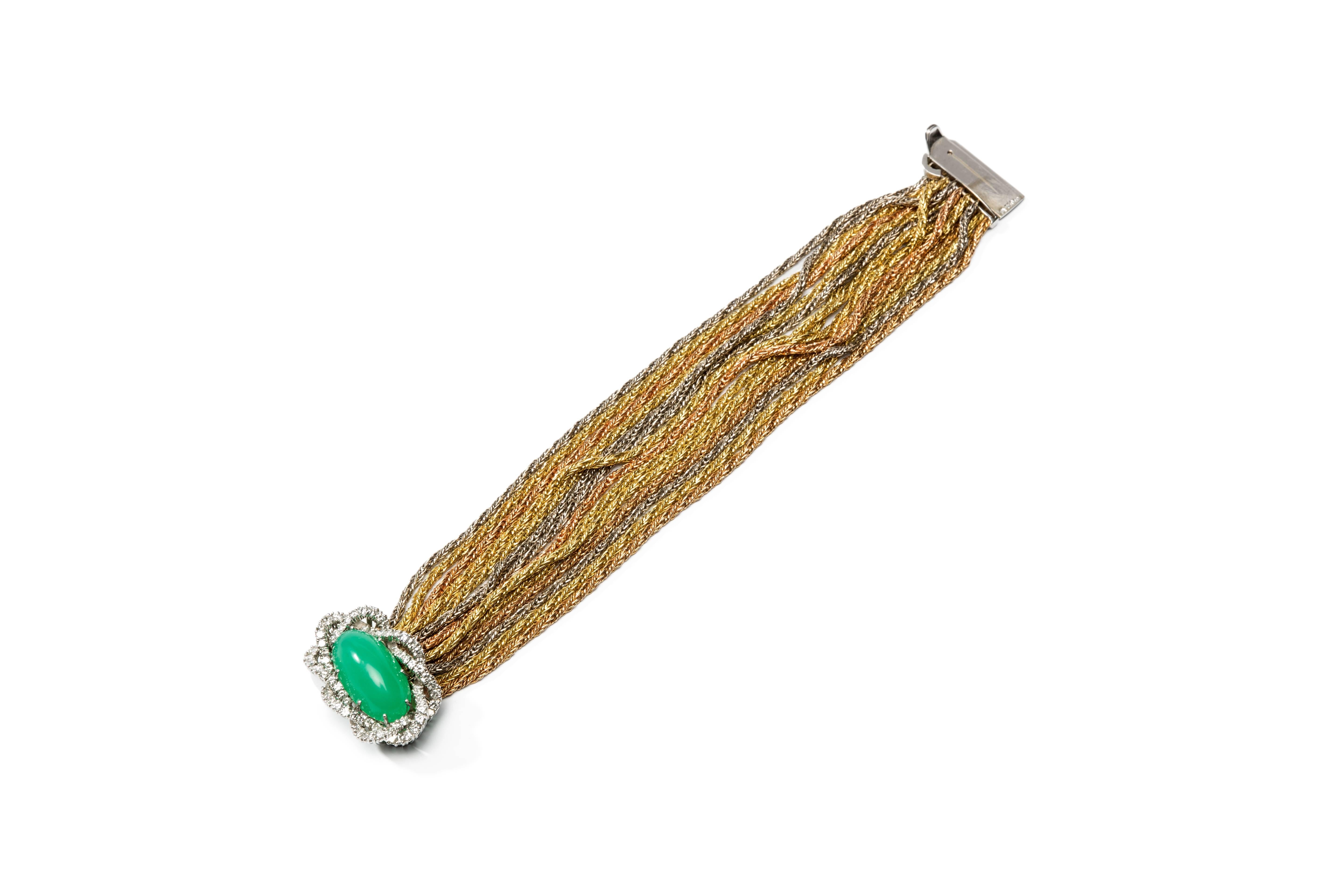 Large chrysoprase cabochon as eye-catcher, surrounded by 76 brilliant-cut diamonds weighing 2,58 ct., mounted in platinum, measurements are: 1.38 x 0.94 in ( 3,5 x 2,4 cm ). 14 ropes in 18 carat yellow- white- and red gold. 
Hallmarked on the clasp: