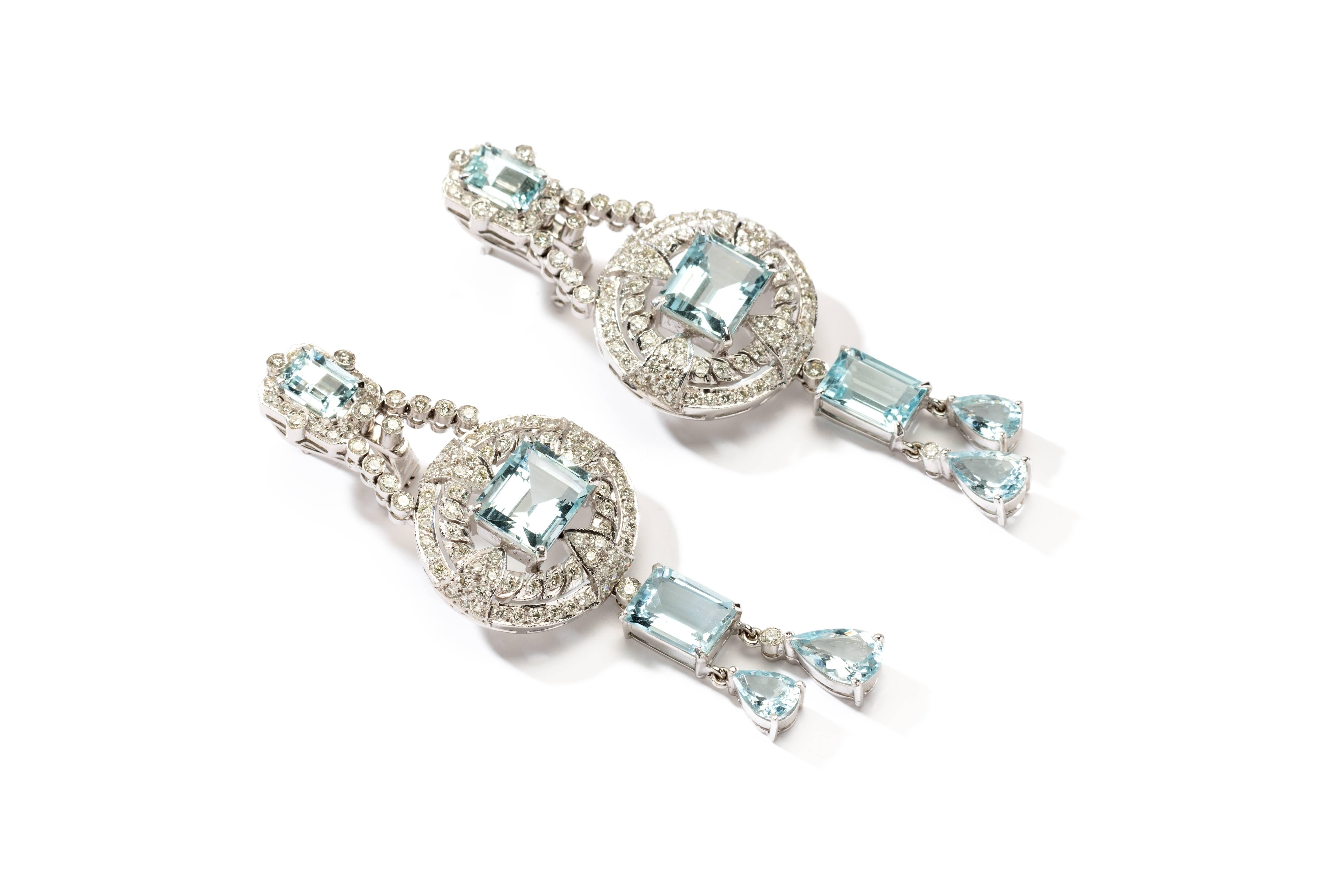 Composed with 6 rectangular-cut aquamarine and 4 tear drop shape aquamarine weighing 14,74 carats, accented by 198 brilliant-cut diamonds weighing 1,98 carats. Mounted in 18K white gold. 
Total weight: 23,89 g. Length: 2.56 in ( 6,5 cm ), Width: