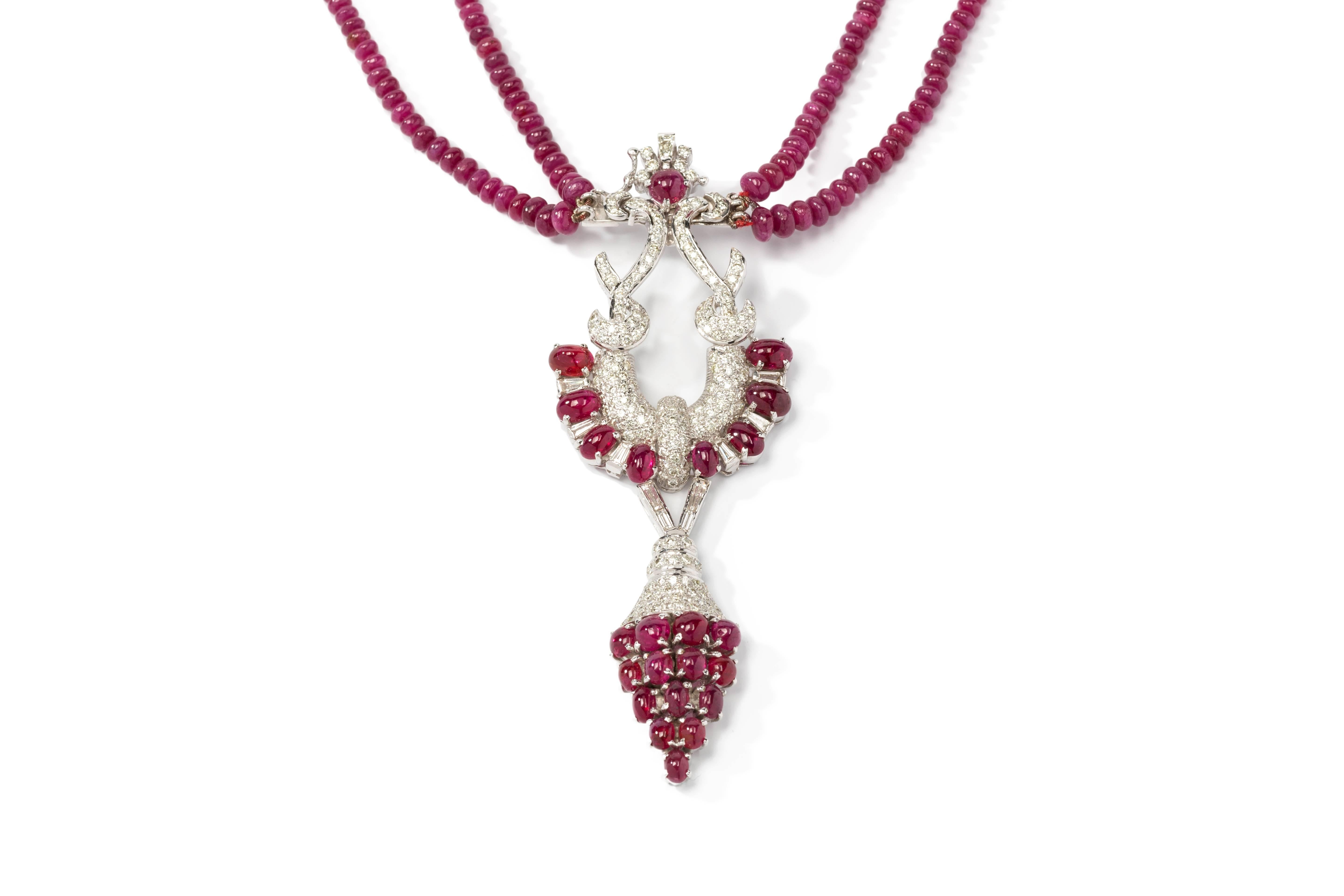 Pavé Set with 23 cabochon-cut rubies weighing 13,4 ct. and 435 ball shape rubies weighing approximately 101,60 ct. Enhanced by 11 baguette-cut diamonds and 207 brilliant-cut diamonds weighing circa 3,47 ct. 
Mounted in 18K white gold. Total weight: