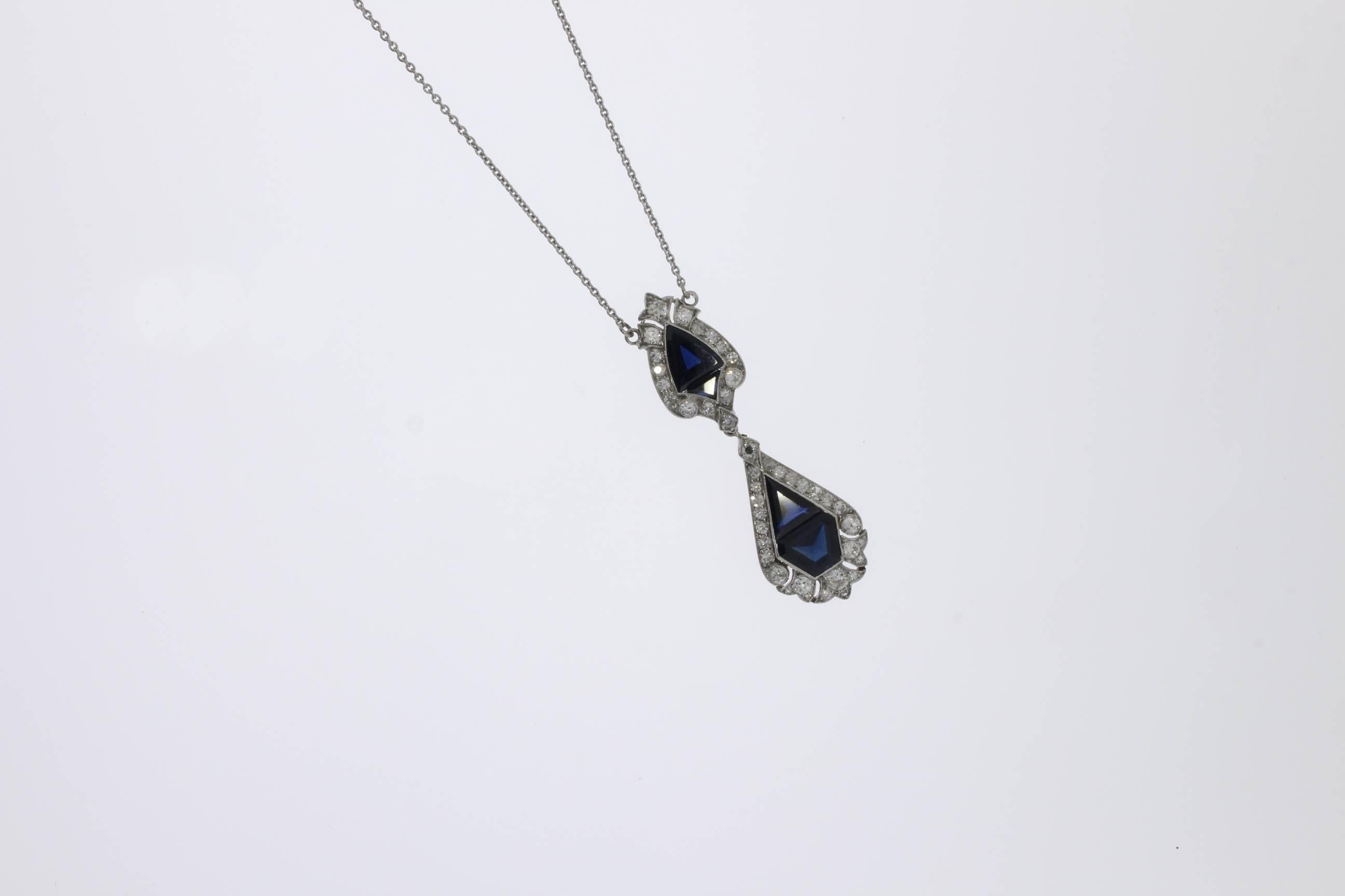 Germany, 2000's. Fine millegrain platinum set with 4 pailin sapphire weighing circa 4,43 ct., surrounded by 43 brilliant-cut and transitional-cut diamonds weighing total circa 1,44 ct. clarity SI, color wesselton. 14K white gold delicate cable chain