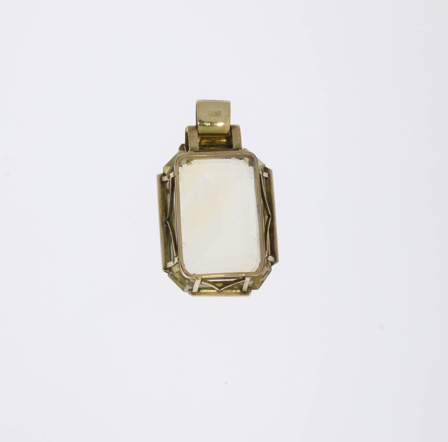 Germany, 1950s. Set with emerald-cut citrine circa 15,11 x 23,57 mm. Mounted in 14 K red gold. Marked with the purity 585 on the loop. Total weight: 24,39 g. Dimensions: 1.77 x 1.06 in ( 4,5 x 2,7 cm ), Height: 0.47 in ( 1,2 cm )