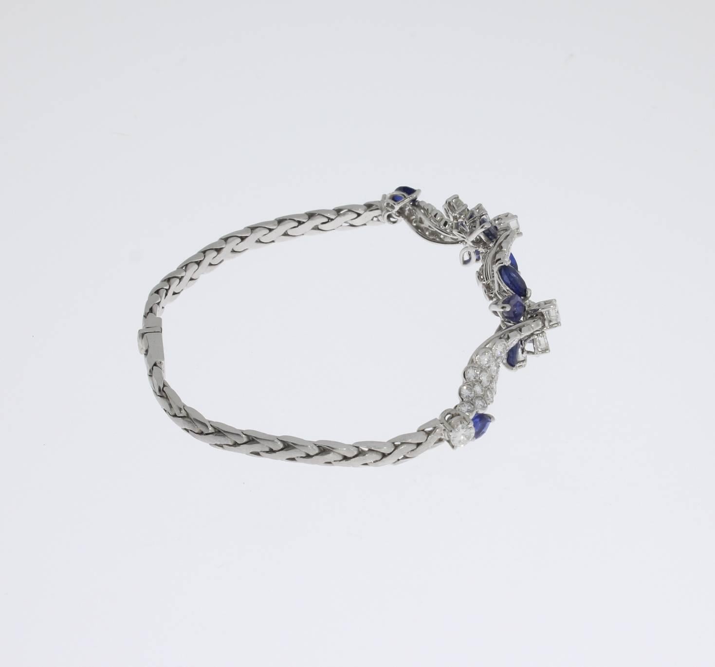 ca. 1985 by Jeweler Christ. Elegant bracelet in royal design with a classic combination of sapphires and diamonds. Set in 18 K white gold with 10 navette-cut sapphires with a total weight of 3 ,0 ct and 68 brilliant-cut diamonds with a total weight