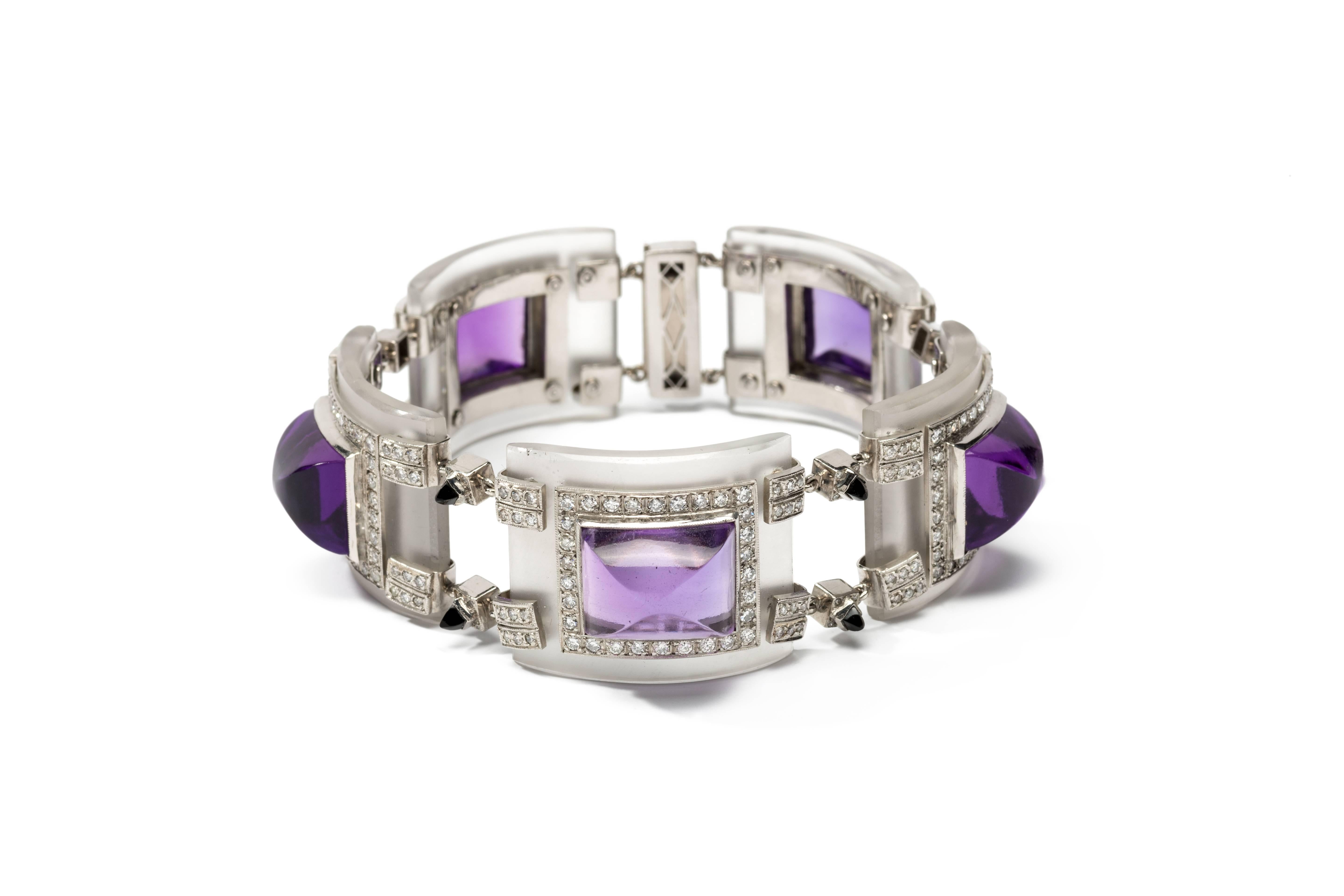 Argentina, about 1975. Set with 5 large sugarloaf- cut amethyst on rock crystal boards, accented by 364 brilliant-cut diamonds weighing approximately 5,60 ct. and 10 onyx. Mounted in platinum. Total weight: 84,20 grams. 
Length: 7.95 in ( 20,2 cm ),
