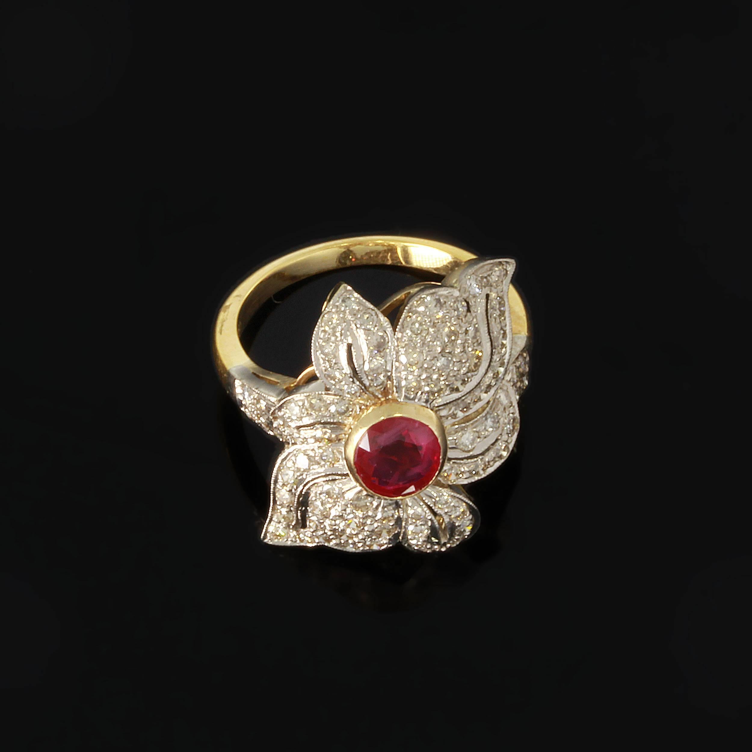 Designed ca. 1990s as a pavé set with an oval-cut ruby weighing approximately 1,18 carats and brilliant-cut diamonds weighing circa 1,15ct. Mounted in 18K yellow gold. Millegrain setting. Hallmarked inside with the purity 750. Total weight: 6,99