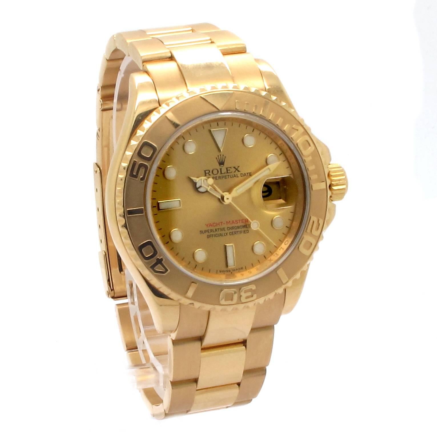 18kt yellow gold case and bracelet. Unidirectional rotating bezel. Champagne dial with luminous hands and luminous dots hour markers. Minute markers around the outer rim. Luminescent hands and dial markers. Date displays at the 3 o'clock position.