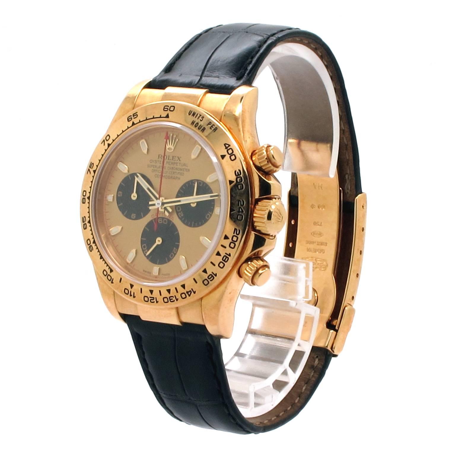 Pre- owned Rolex Daytona 18K Yellow Gold with Original Paul Newman champagne Cosmograph dial. Genuine Rolex Black Leather Strap. 40mm 18k Gold case, tachymeter engraved gold bezel, screw-down push buttons, and 18K Gold Oyster flip-lock buckle with