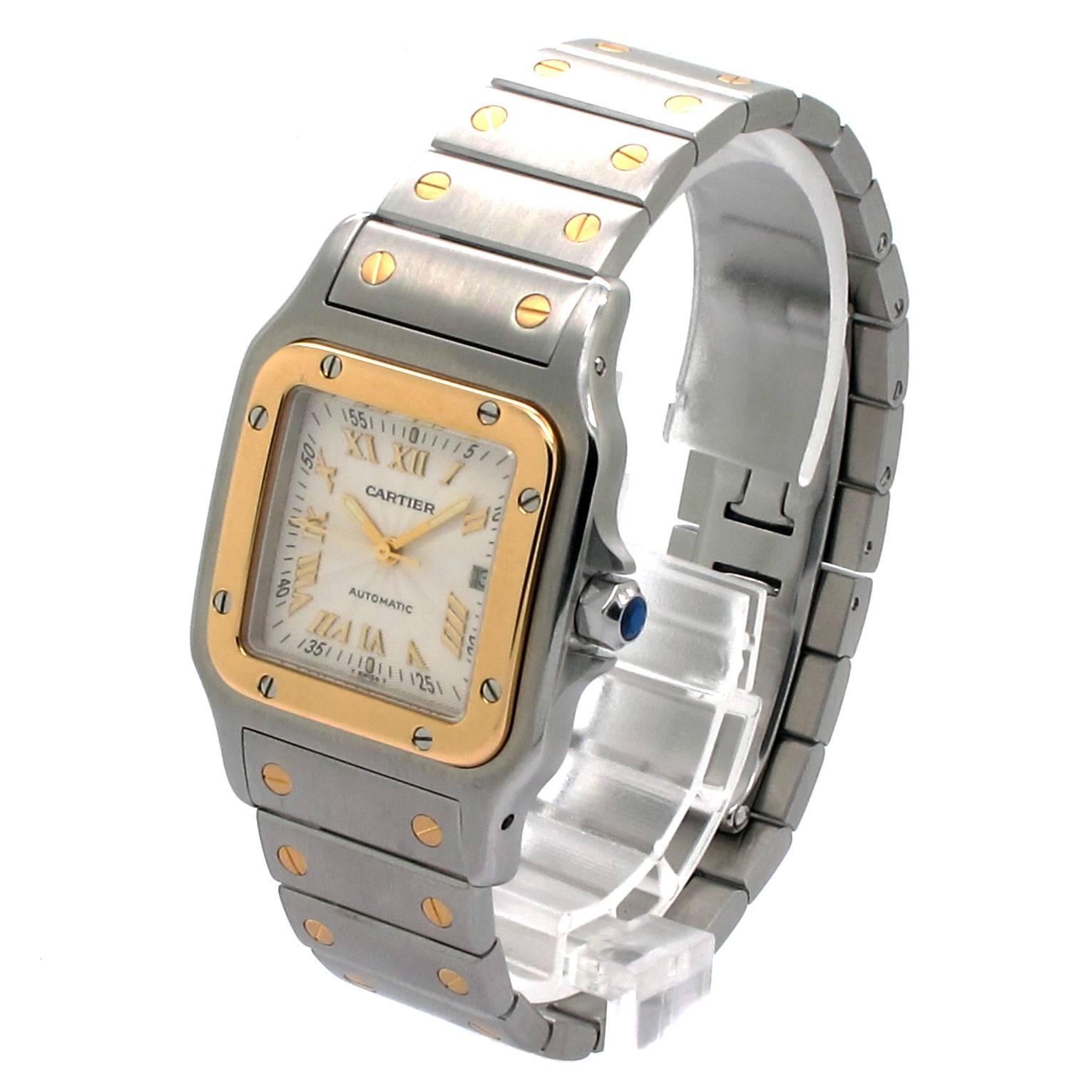 Cartier Santos Galbee W20058C4 Two-Toned Unisex Watch with a 29mm Stainless Steel Case and a fixed Original Cartier 18K yellow gold bezel punctuated with 8 signature screws. Original Cartier silvered Guilloche dial with raised gold roman numerals.
