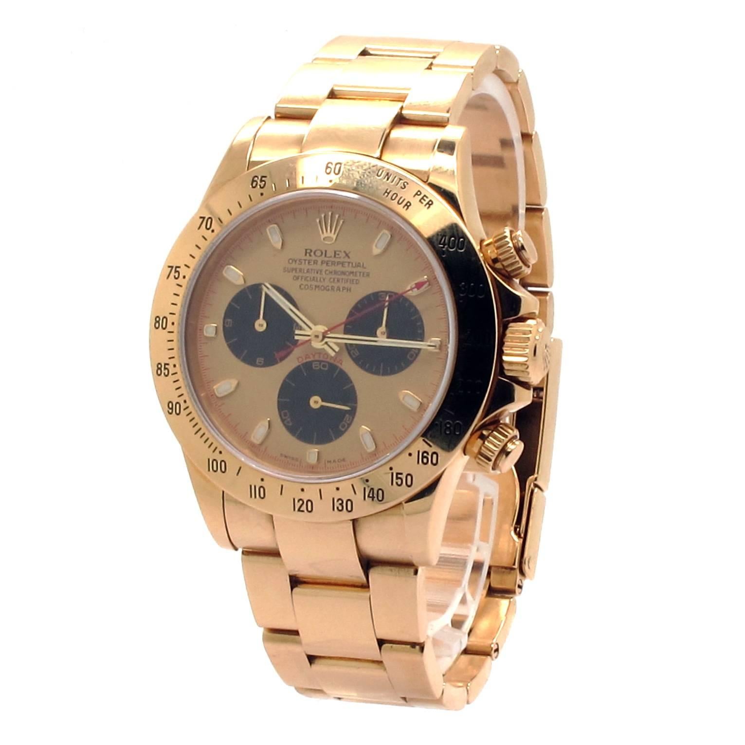 Rolex Daytona 18K Yellow Gold with Original Paul Newman champagne Cosmogrpah dial. Genuine Rolex 18K Gold Bracelet with Oyster Fliplock buckle. 40mm 18k Gold case, tachymeter engraved gold bezel, screw-down push buttons. 2000 model 7.25