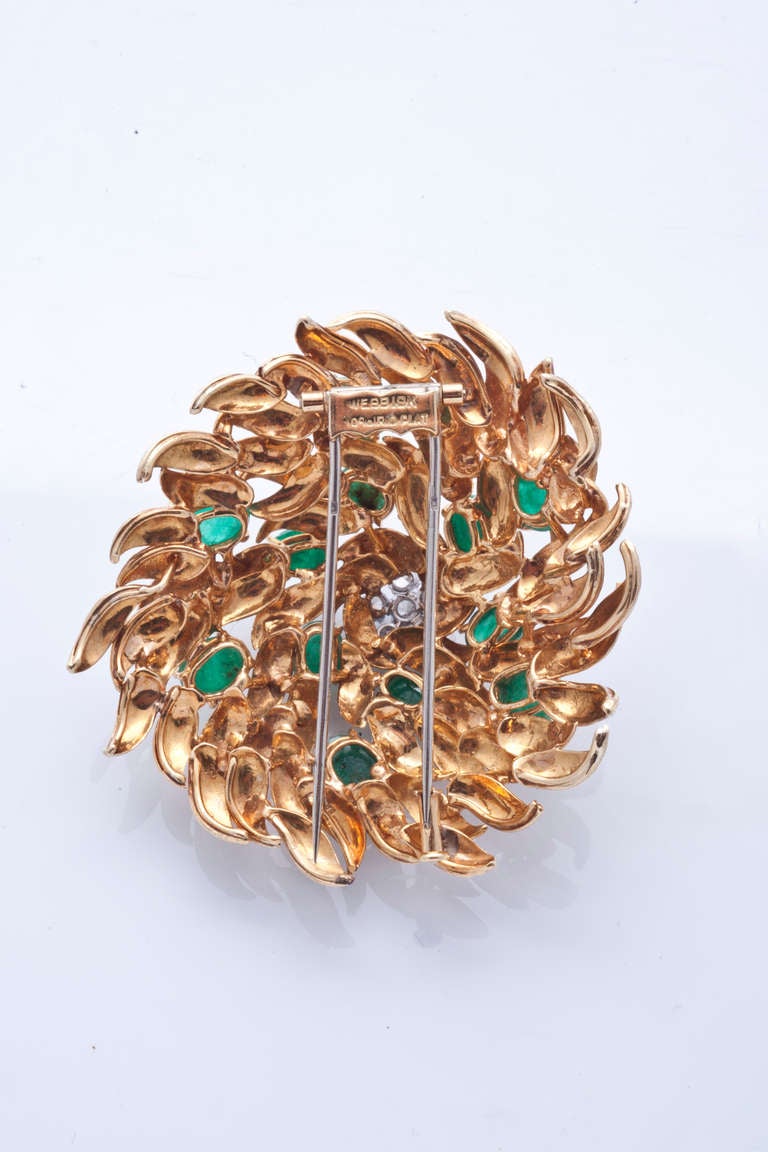 18k yellow gold, diamonds and cabochon emeralds 1960s brooch by David Webb.