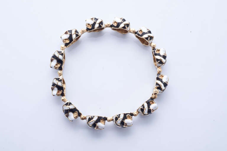 Women's gold and enamels feline bracelet.