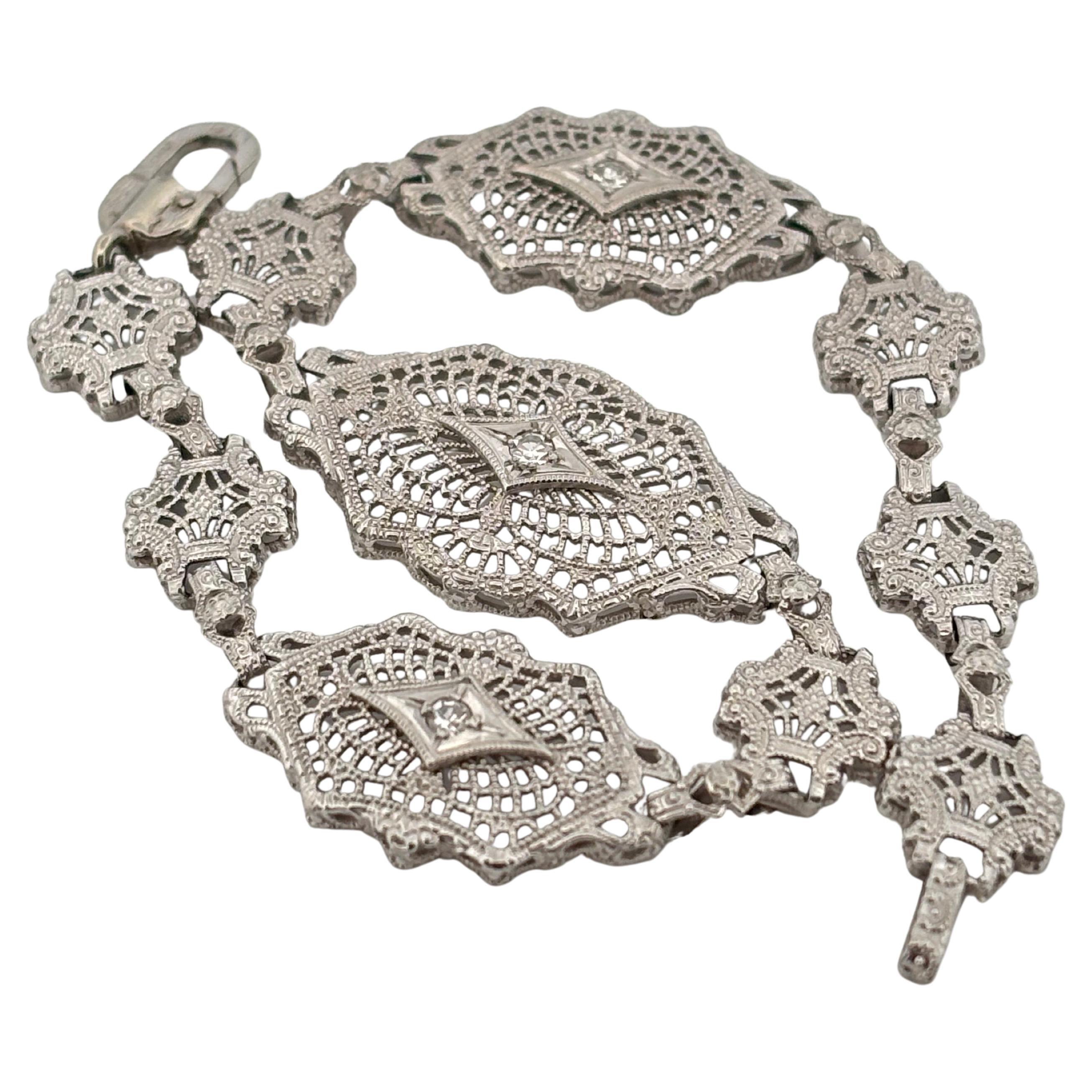This exquisite vintage bracelet by ESEMCO is finely crafted in 10K white gold and showcases the brand's signature attention to detail. Featuring a series of intricately designed openwork panels, the bracelet exudes the elegance of the Art Deco era.