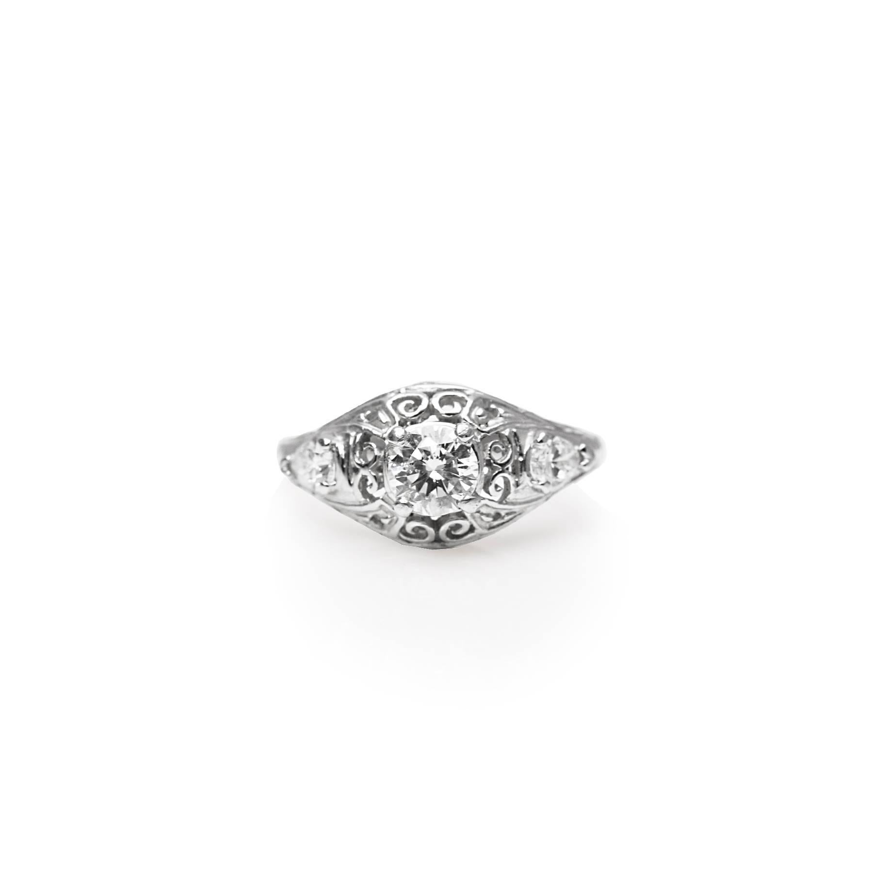 Platinum Estate Round and Pear Shaped Diamond Engagement Ring
Round Diamond = 0.50 ct; Two Pear Shape Diamonds = 0.40 ctw 