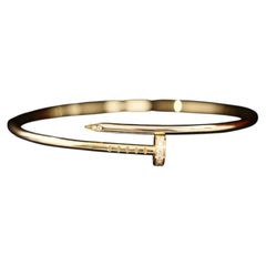 Brazalete «Juste un Clou» de Cartier, modelo pequeño, con clavo de diamantes, en oro rosa de 18k, talla 17