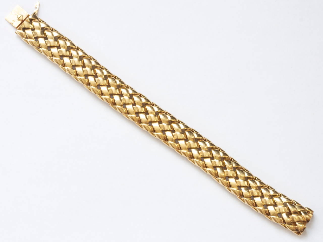 A classic and timeless design from the Van Cleef & Arpels jewelry house. The gold has been delicately woven throughout the bracelet showing the attention to detail it took to create this fine piece of jewelry. Crafted in 18k gold with original VCA 