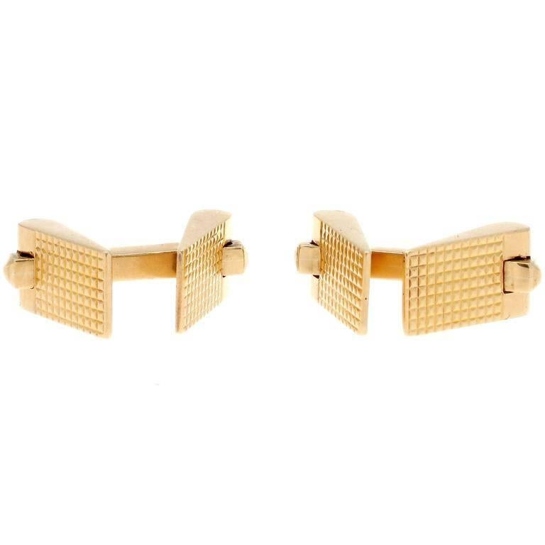 Timeless elegance to be expected from the long standing French masonry of Cartier. Created with rectangles of mesh detailed in the 18k yellow gold. Signed Cartier, numbered and stamped with French hallmarks.