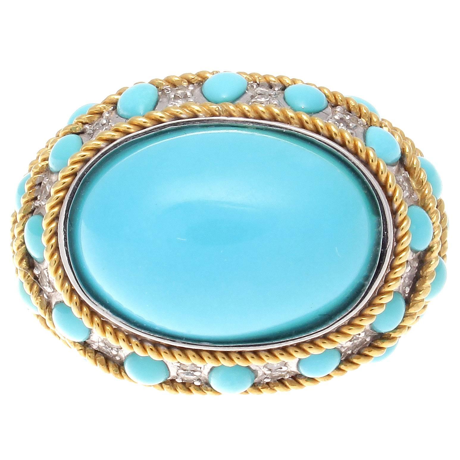 Big, bold and colorful designs. Influenced from the retro time period which made a reappearance in the 1970's and 80's creations. 

Featuring a bright cabochon cut turquoise that is perfectly complimented by cascading tear drops of matching