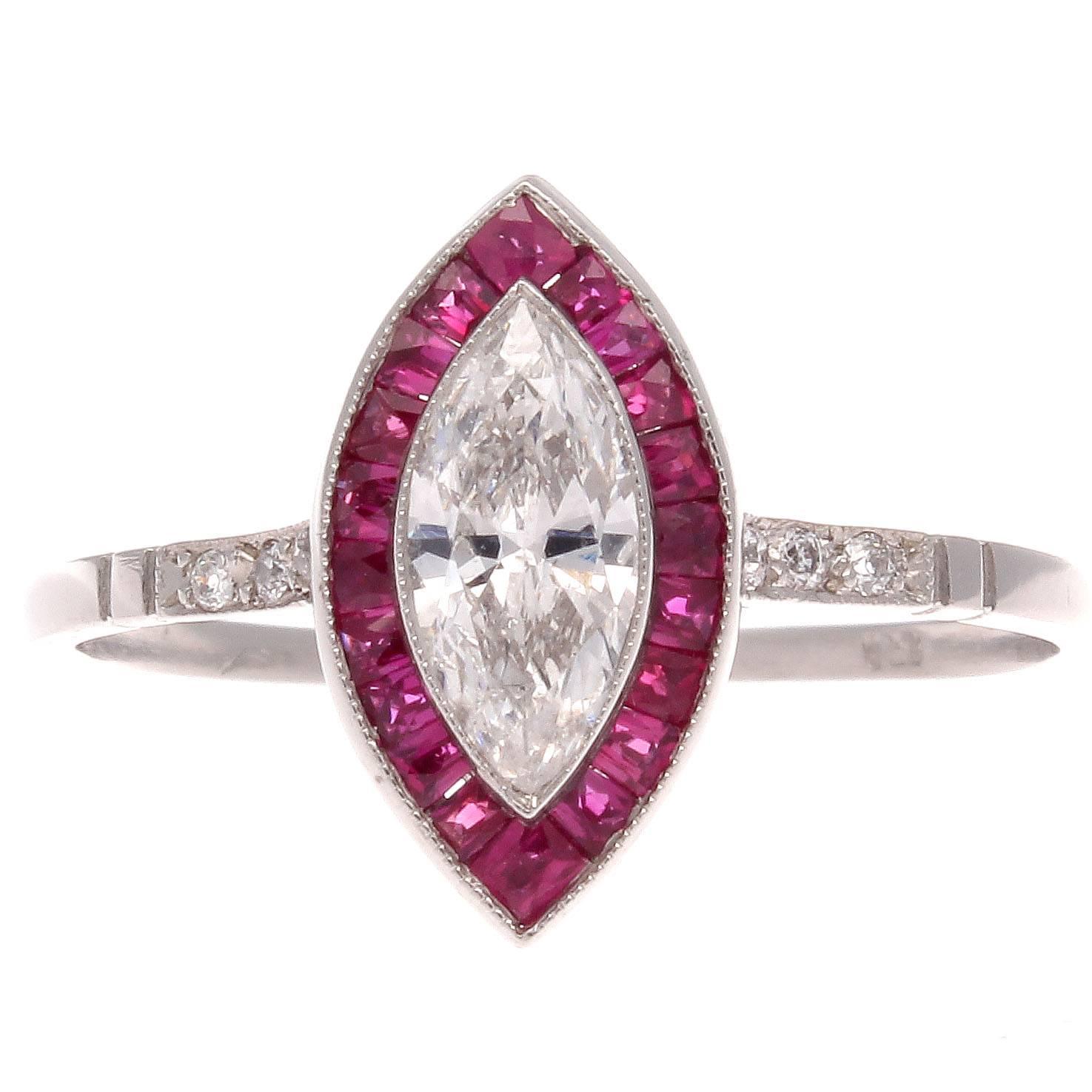 A colorful rendition on the classic halo ring. Featuring a 0.46 carat marquise cut diamond surrounded by a vibrant halo of red rubies that flow into a cascade of perfectly matching white diamonds in the platinum band.

Ring size 6 and may be resized.