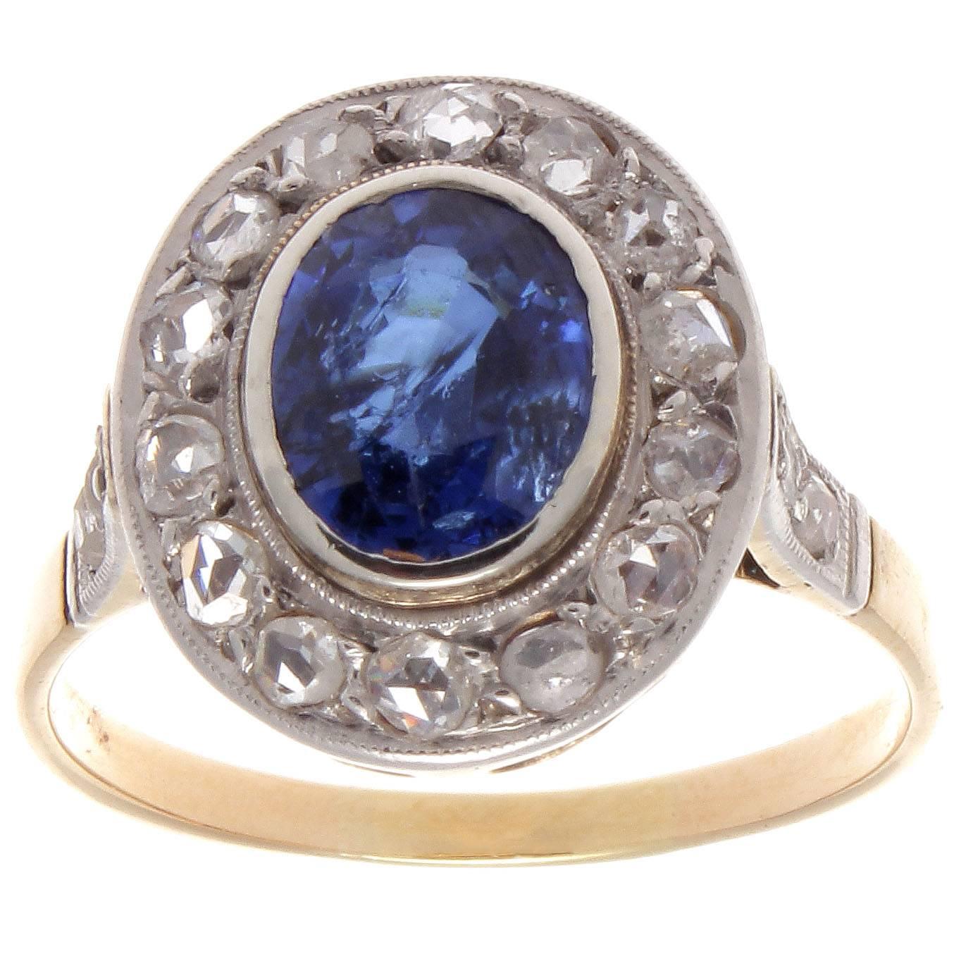 A classic combination of color infused with the forever in style halo ring that has been popular since the 19th century. Featuring a deep royal blue oval cut sapphire that weighs approximately 1.65 carats and is surrounded by a halo of 18 ancient