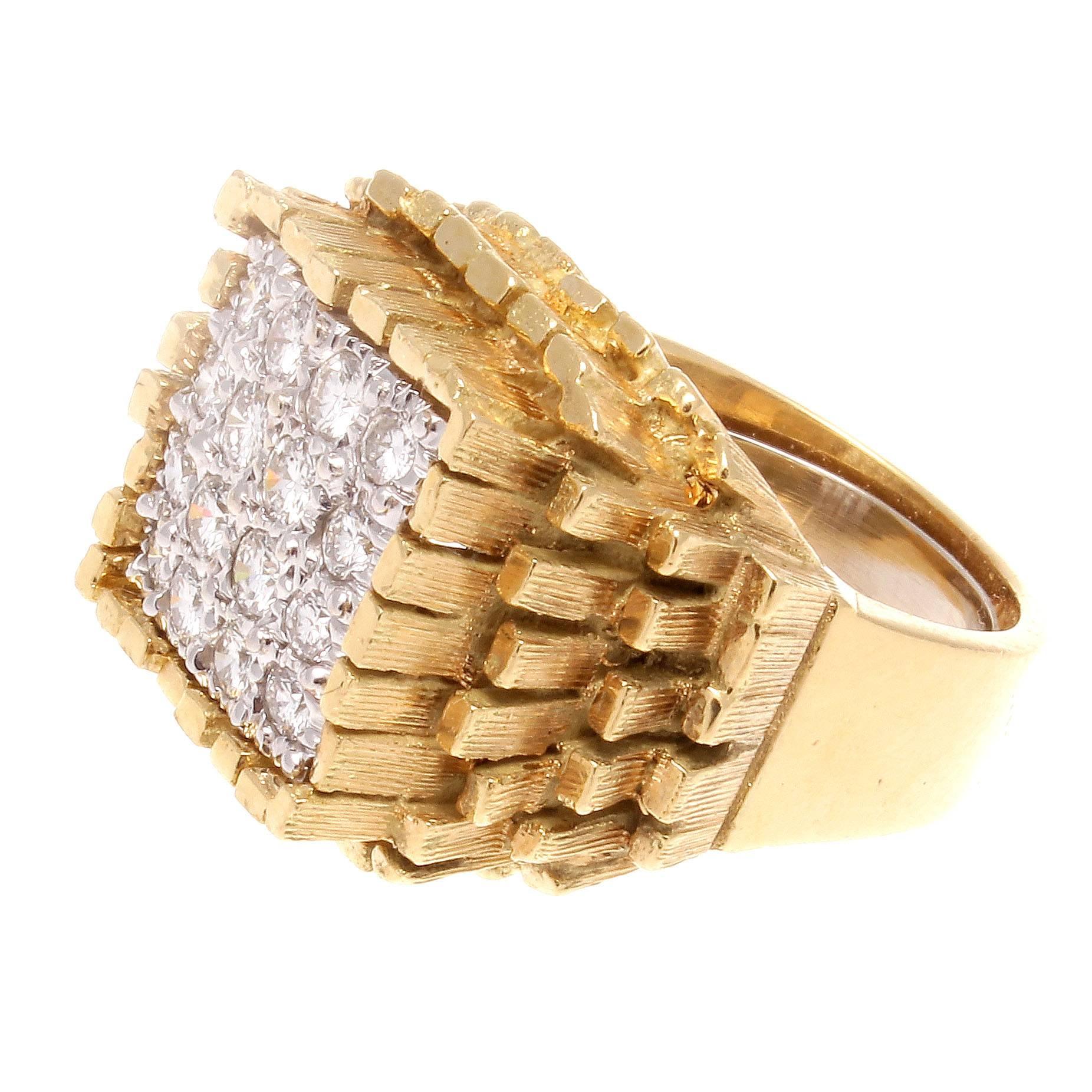 A rustic geological design that appears to have brought the rough to the ring. Elevated on mountains of glistening yellow gold the colorless diamonds are hidden at the peak where they are exposed for viewing. Crafted in 18k gold. Signed Hammerman