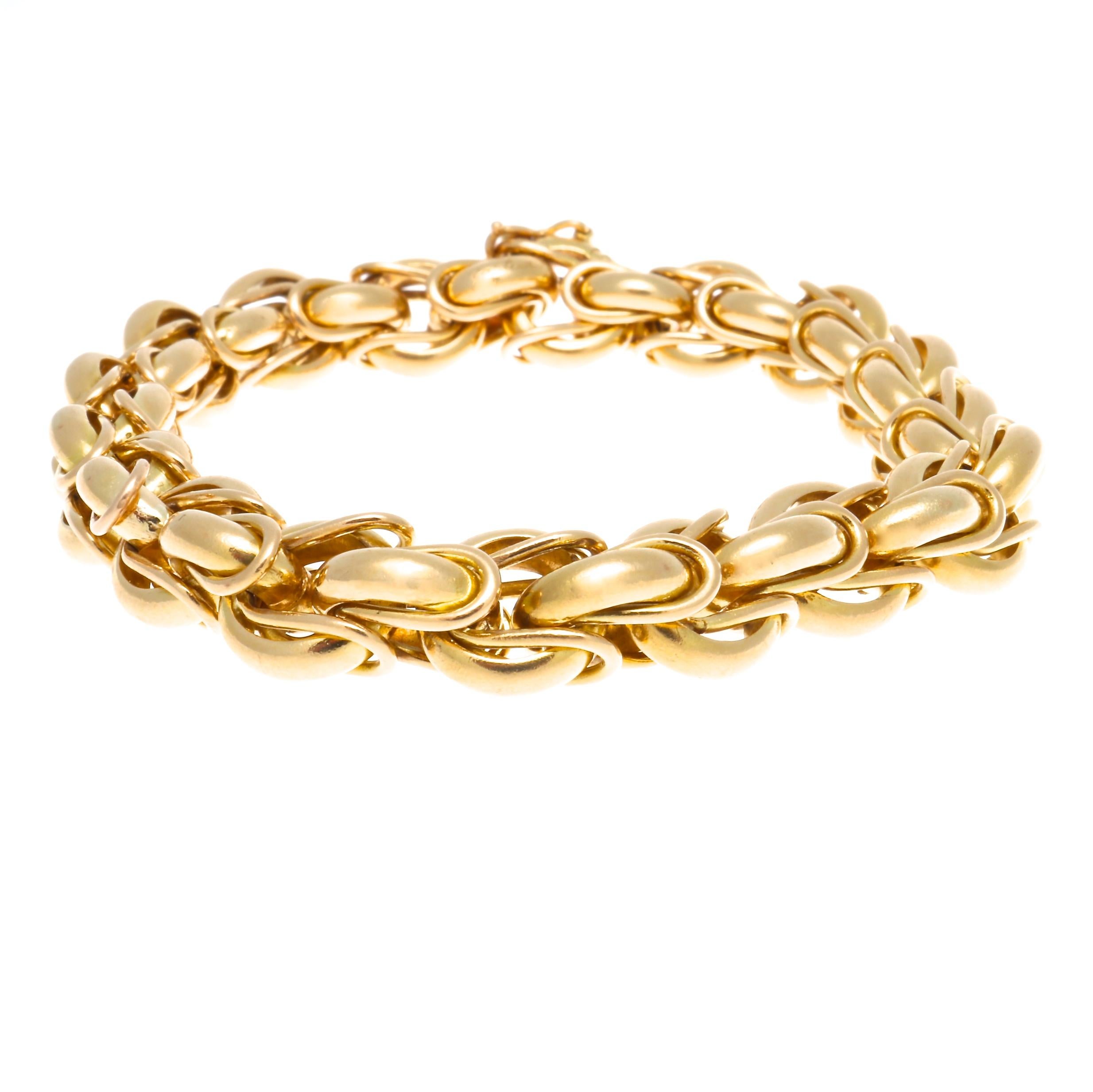 Avant garde, yet sophisticated and elegant design is what has kept Cartier relevant for centuries and cemented their place at the  top of the jewelry world. Featuring interlocking links of glistening 18k gold gently rolling over one after another.