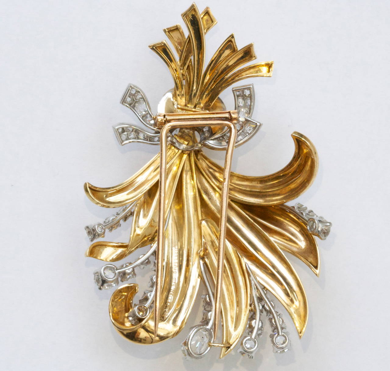 The Mellerio French jewelry house was established in 1613 and claims to be the oldest family company in Europe; and is known to be the oldest French jewelry house. On display, Mellerio has created a bouquet motif. Elegant supple gold leaves