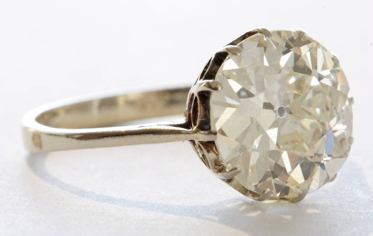 A well made old European cut diamond that sparkles. Residing in an original art deco solitaire platinum ring. We approximate the center diamond to be 4.20 carats with a slight yellow hue. Approximately M color and VS quality. 

Ring Size 7 1/2 and