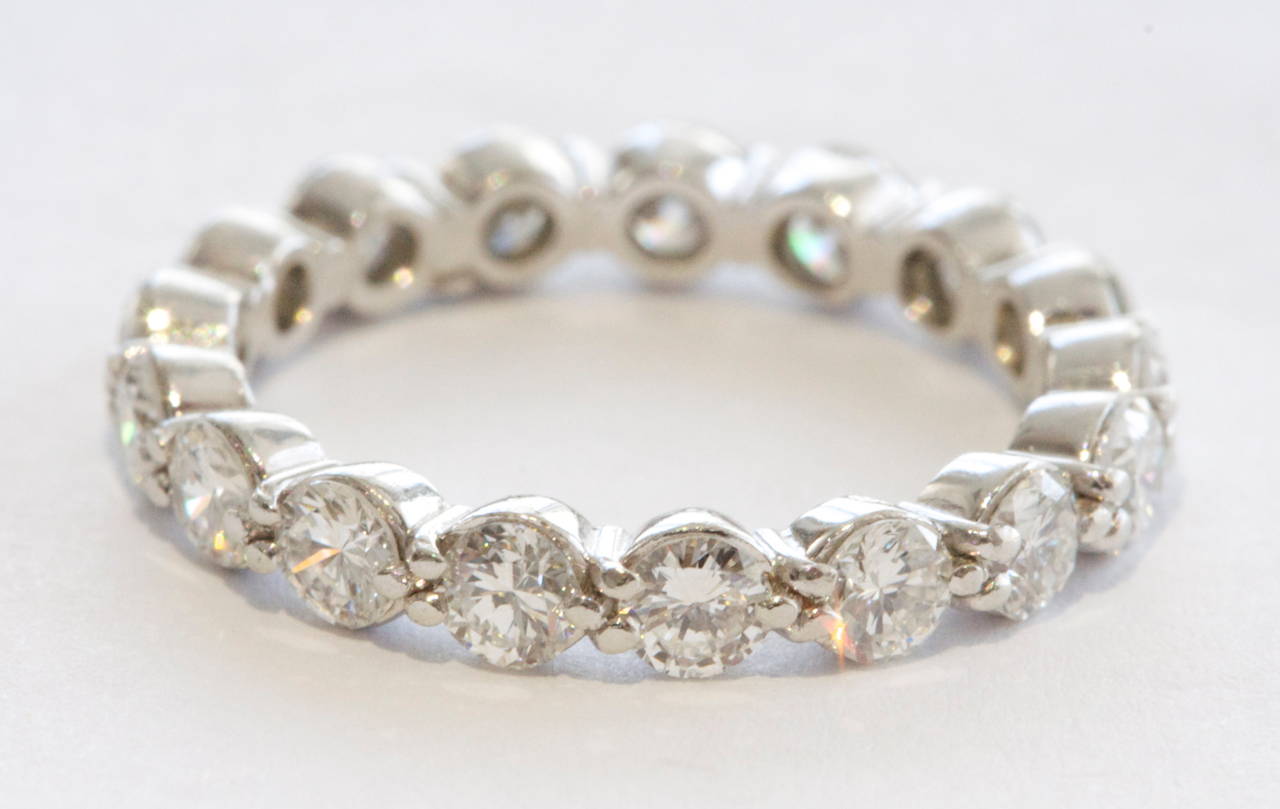A well designed eternity band.  Created with 17 round cut diamonds weighing 0.10 carats each for a total carat weight of 1.70. The diamonds used are E-F in color and VVS in clarity.

Signed, with French hallmarks.

Size 6