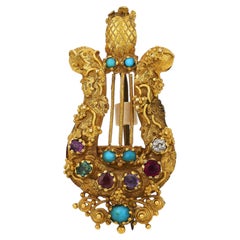 Broche victorienne en forme de lyre, en or jaune 18 carats, ornée de pierres précieuses multicolores
