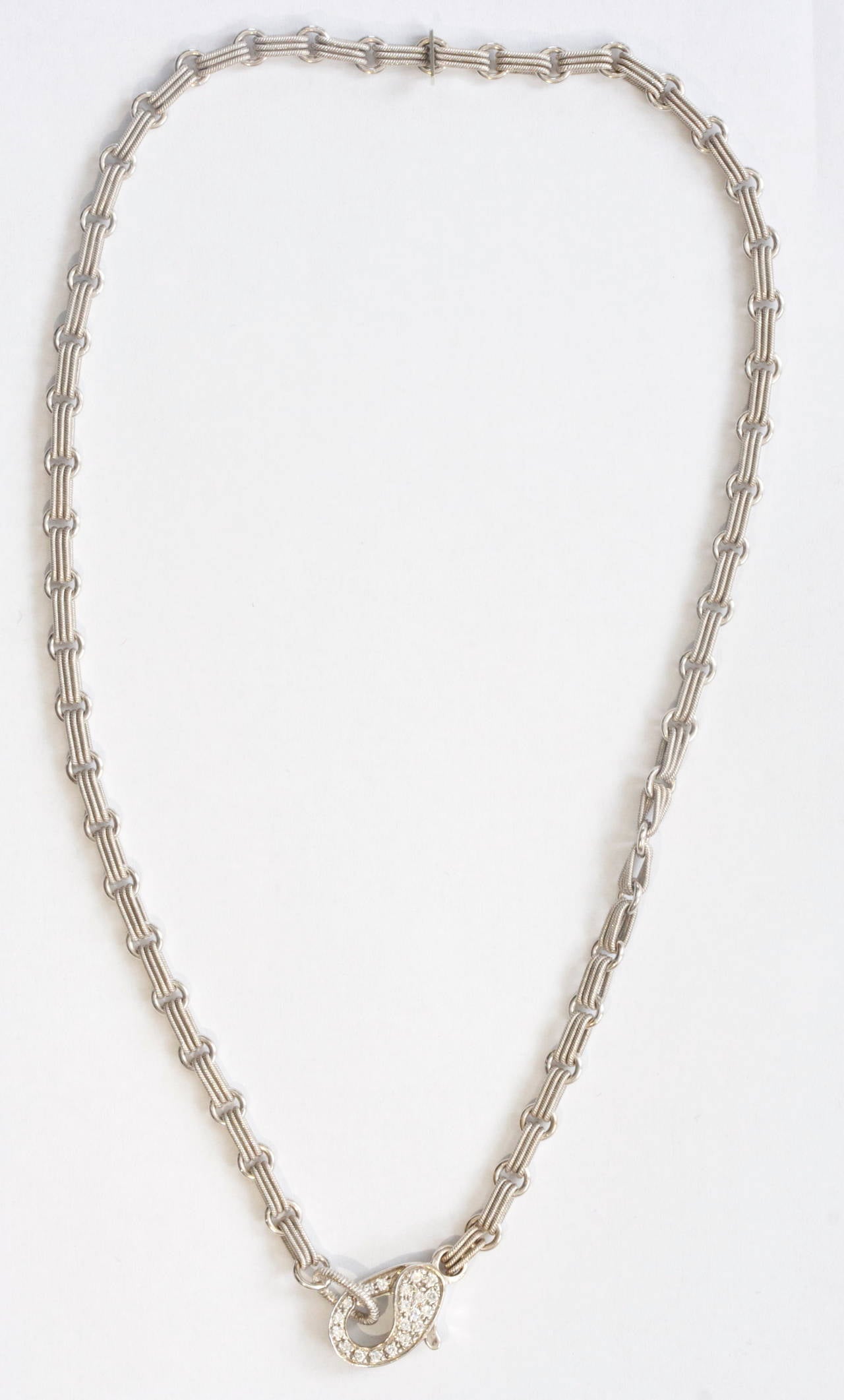 Pepi is a jewelry designer in Beverly Hills and has a store on Robertson Blvd. She has creatively linked this necklace with 2 different circular shapes to make a simple yet eye pleasing piece of jewelry. The lobster blast has been covered with pave