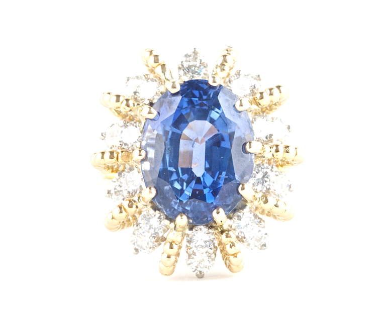 A great Heyman Brothers ring. The sapphire weighs 11.98 and is certified by GIA as Ceylon Origin with no indications of heat. In 18k gold with clean, white diamonds as accents.

Ring size 6 and can be re-sized.