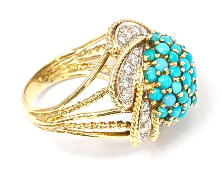 So well made. The ring is 18k gold and the well matched turquoise stones have been perfectly set. 

Ring size 6 1/2 and can be re-sized.