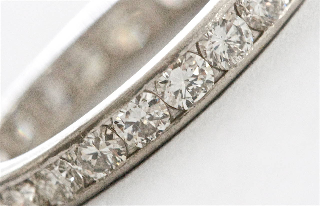 A beautifully made art deco diamond eternity band. Designed with 23 white, clean round cut diamonds channel set in a hand made platinum ring. The total approximate weight is 1.00 carat. Engraved with the date 5-3-30.

Size 5 3/4
