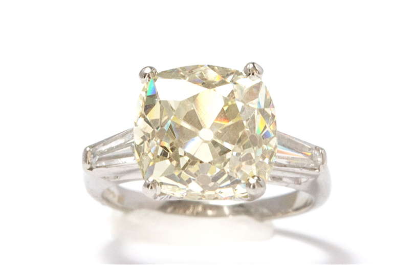 Great old miner diamond. Clean stone and very light cape, warm tones of yellow. Set in a platinum ring.

Size 5 1/2 and can be re-sized.