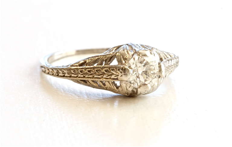 Lovely filigreed platinum ring from the 1930s, with the diamond weighing approximately 0.35 carats. The filigree work is well done and the vintage look is very charming.

Ring size 5 and can be re-sized.