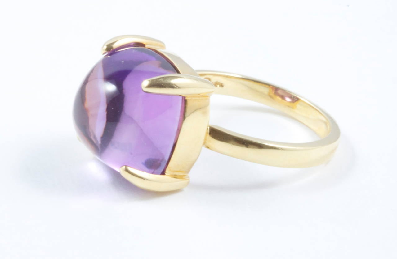 A luscious purple is displayed from the 8.50 carat smooth cabochon amethyst. It has been delicately placed in the 18k yellow gold ring. This ring currently retails for $1,400.

Signed Tiffany & Co Paloma Picasso.

Ring size 6 and can be re-sized.
