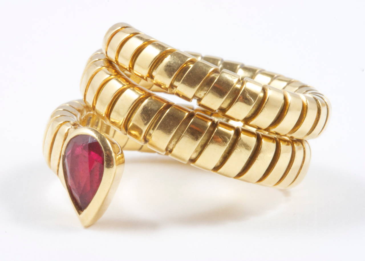 A classic design from the Tubogas collection at Bulgari. A snake motif designed with a high quality pear shaped ruby head. Crafted in 18k yellow gold. Signed Bvlgari and numbered.

Size 6