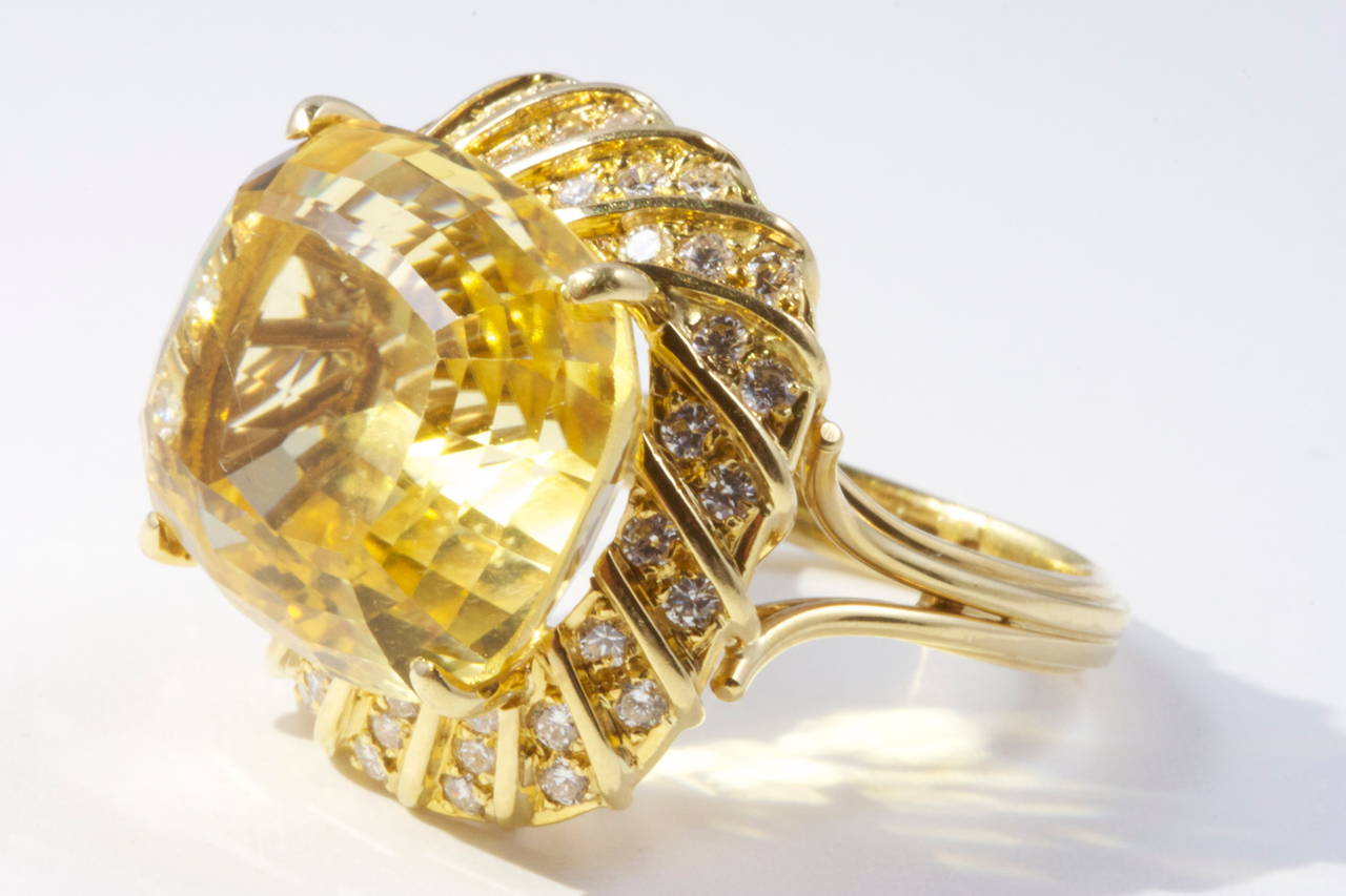 A large golden citrine cocktail ring surrounded by a spiral flow of white diamonds. Crafted in 18k yellow gold.

Ring size 8