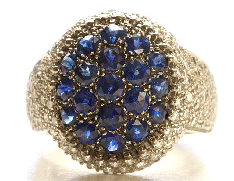 From the house of Mouawad. Beautiful blue sapphires and top quality diamonds expertly set in a 18k gold ring.

Size 7 and can be re-sized