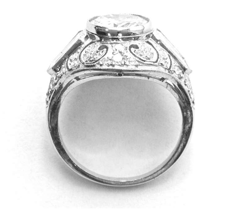 The old European cut diamond is GIA certified as I color and VVS2 clarity. Set in a hand crafted original Art Deco platinum ring.

Ring size 6 and can be re-sized