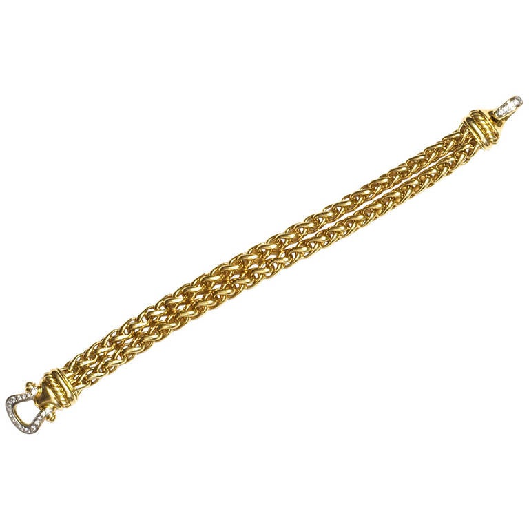 Great link bracelet by David Yurman. In 18k gold with diamonds on the buckle.