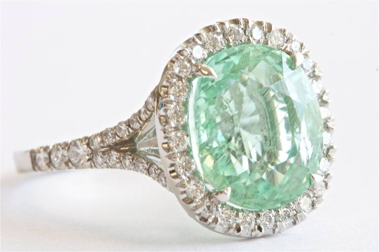 A clear good looking and clean Paraiba with an electric bluish green color. These stones are very rare in this size and quality.  Accompanied by a GIA certificate.

Ring size 6 and can be re-sized.