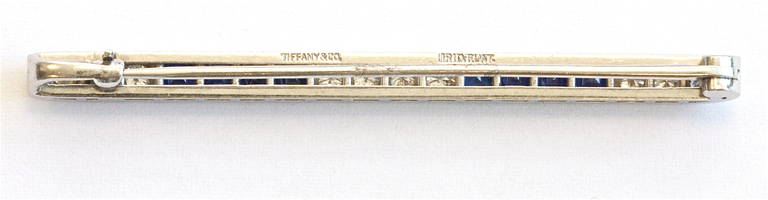 Excellently crafted Art Deco sapphire and diamond brooch by Tiffany & Co. displaying the uniqueness of the art deco period. The sapphires and diamonds are of top Tiffany quality and are expertly set in platinum. Signed Tiffany.