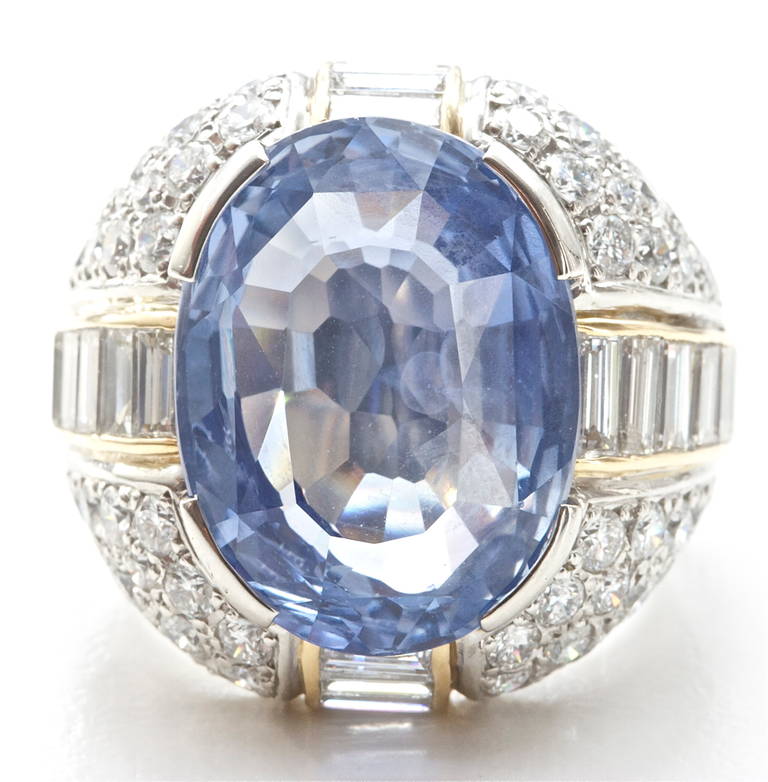 This big bold ring features a 32.11 carat Ceylon sapphire with no indications of heating. It is accented by round and baguette cut diamonds that are very clean and white with a total weight of 7.14 carats. 

WARNING: Side effects may include