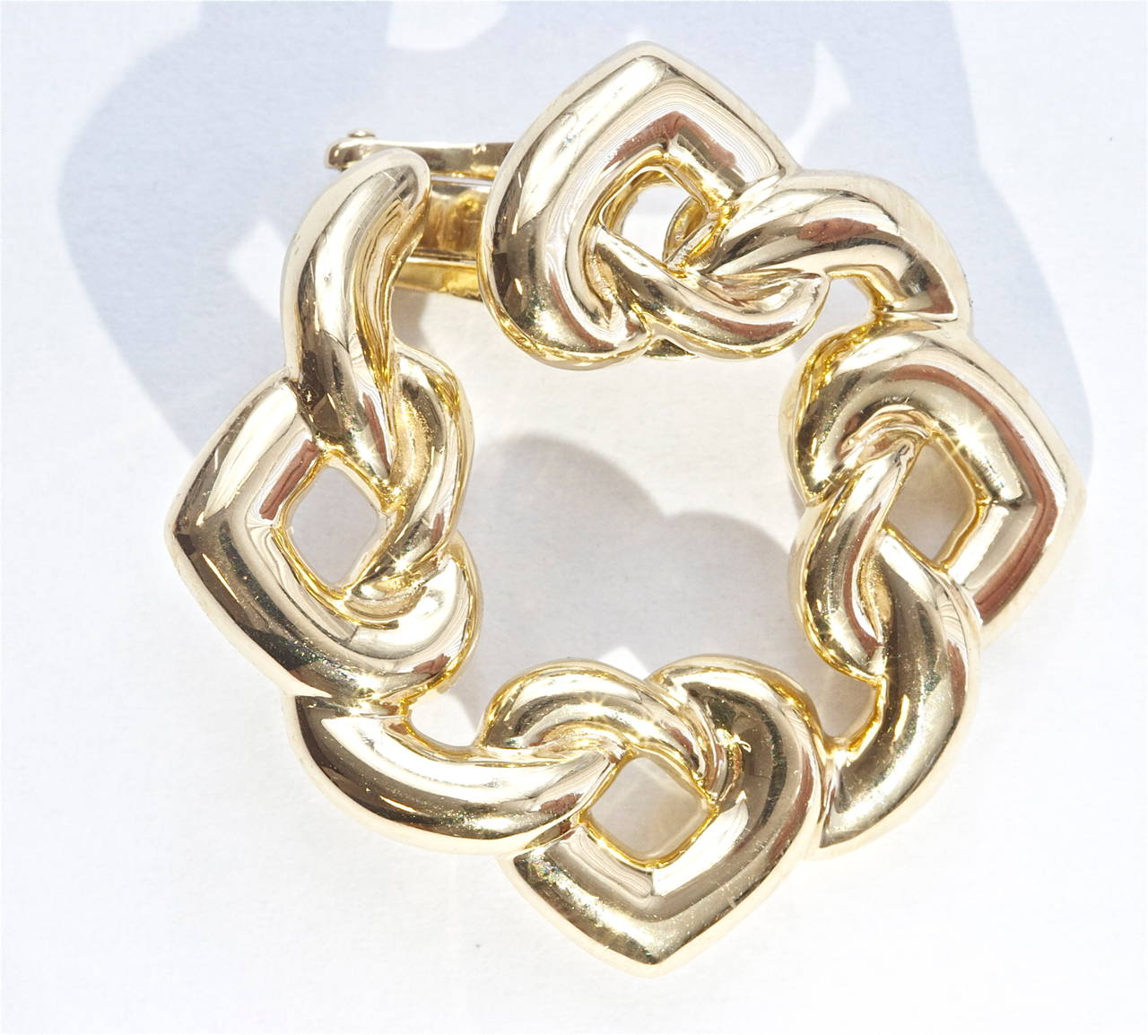 18K Gold interlocking heart earrings by Bvlgari.  Good for any occasion.

Signed Bvlgari and numbered.