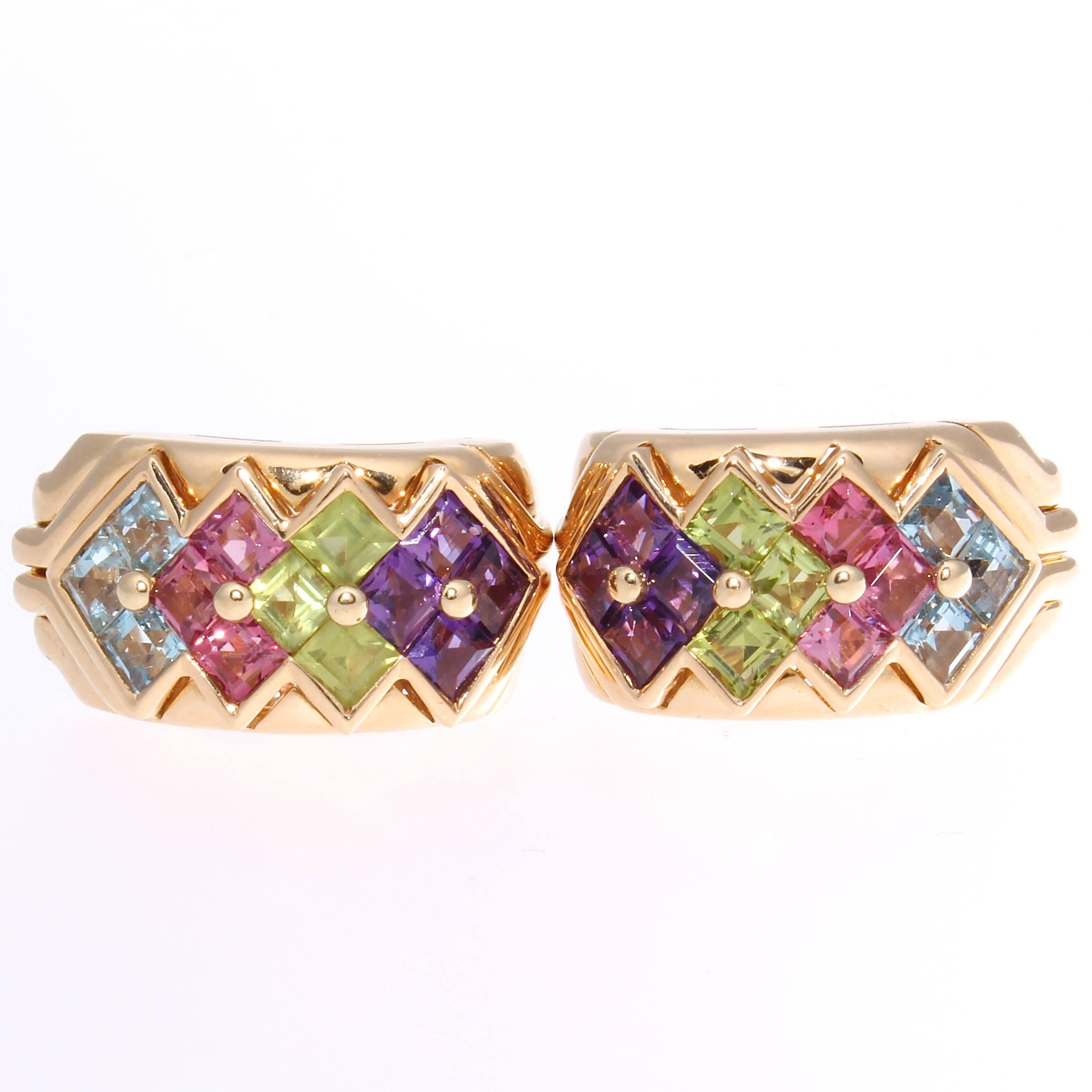 An entrancing color display from the fashion forward thinking designers at Bulgari. Created with multiple square cut purple amethyst, green peridot, pink tourmaline and blue topaz. Crafted in fine Italian 18k yellow gold.

The dimensions are 1