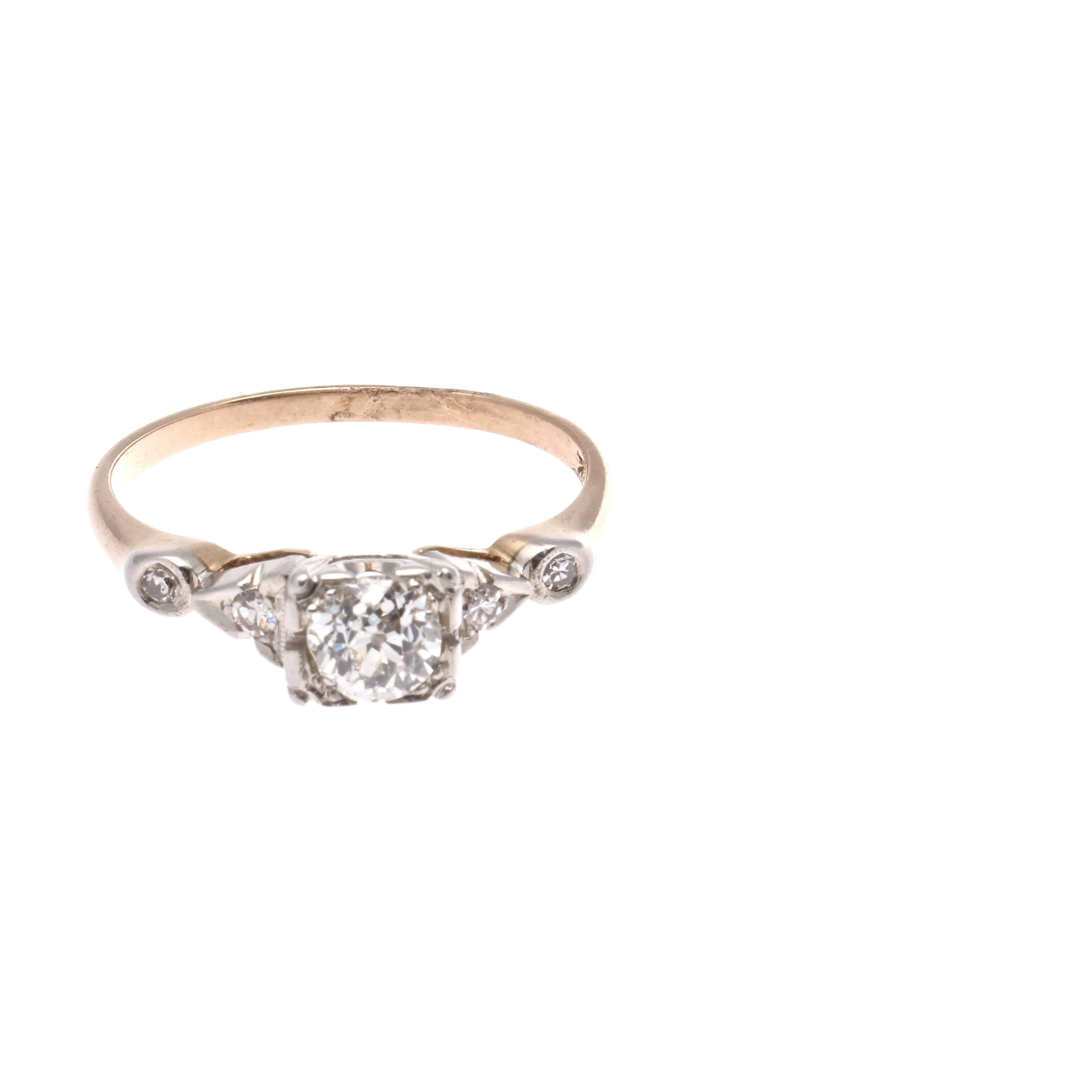 A lovely old cut sparkling diamond is featured in this graceful victorian ring. Accented by two smaller round cut diamonds on either side and hand crafted in an 14k yellow gold ring. 

Ring size 6 and may be re-sized.